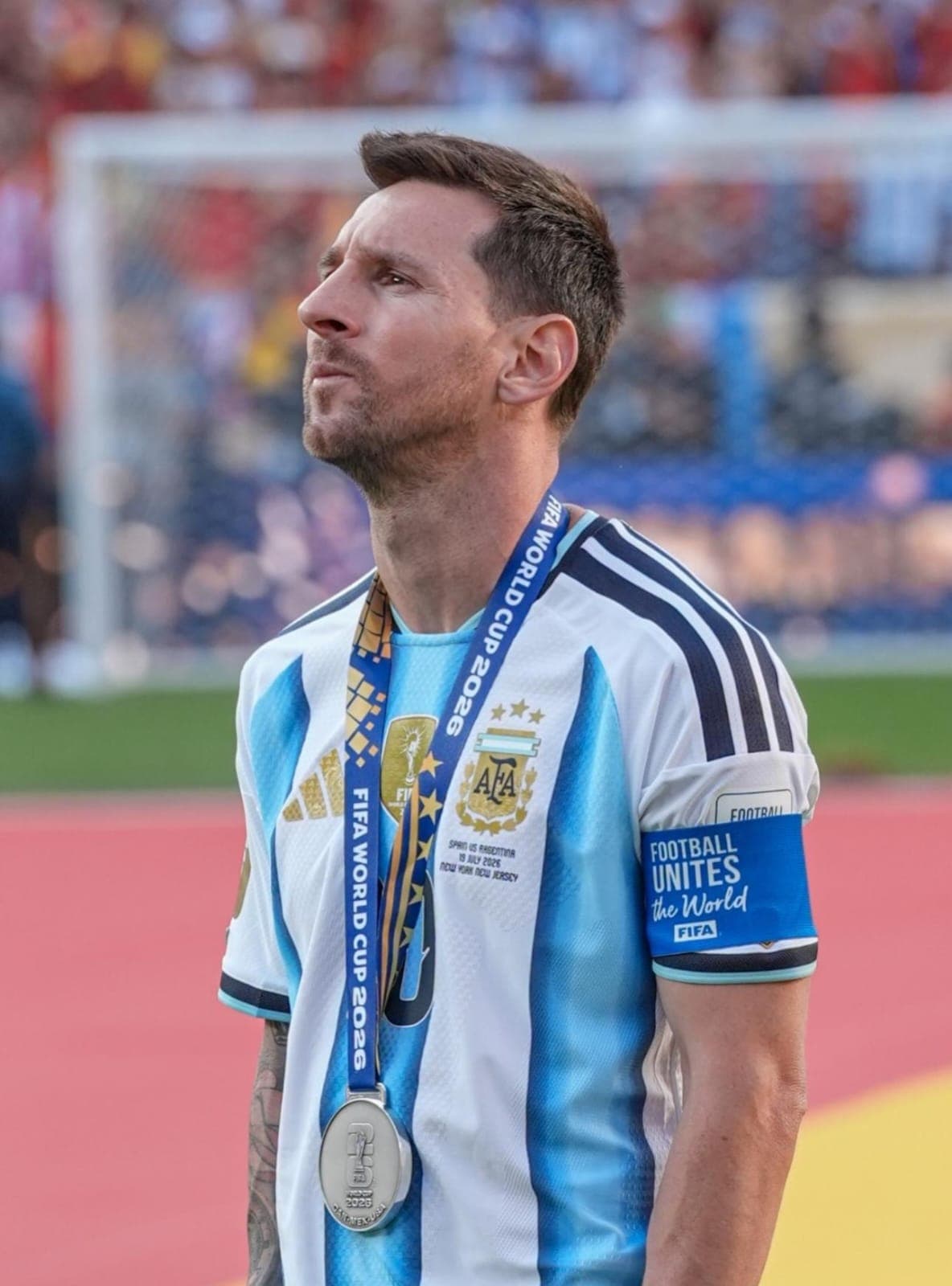 Lionel Messi with his father Jorge Messi smiling together.