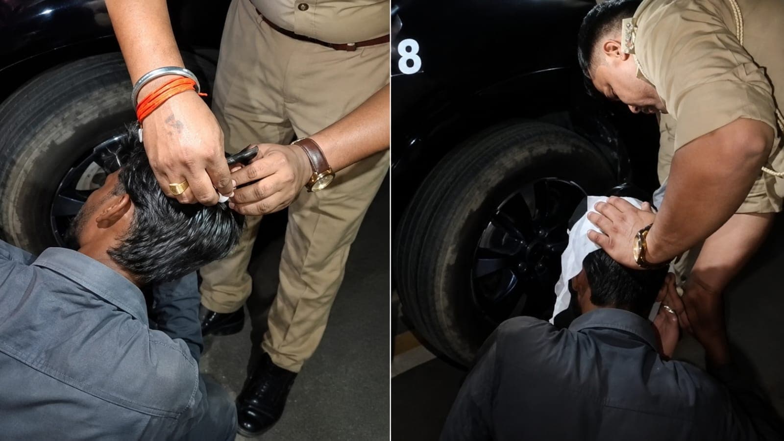 Indian police personnel assisting an injured devotee receiving first aid on the head at night.
